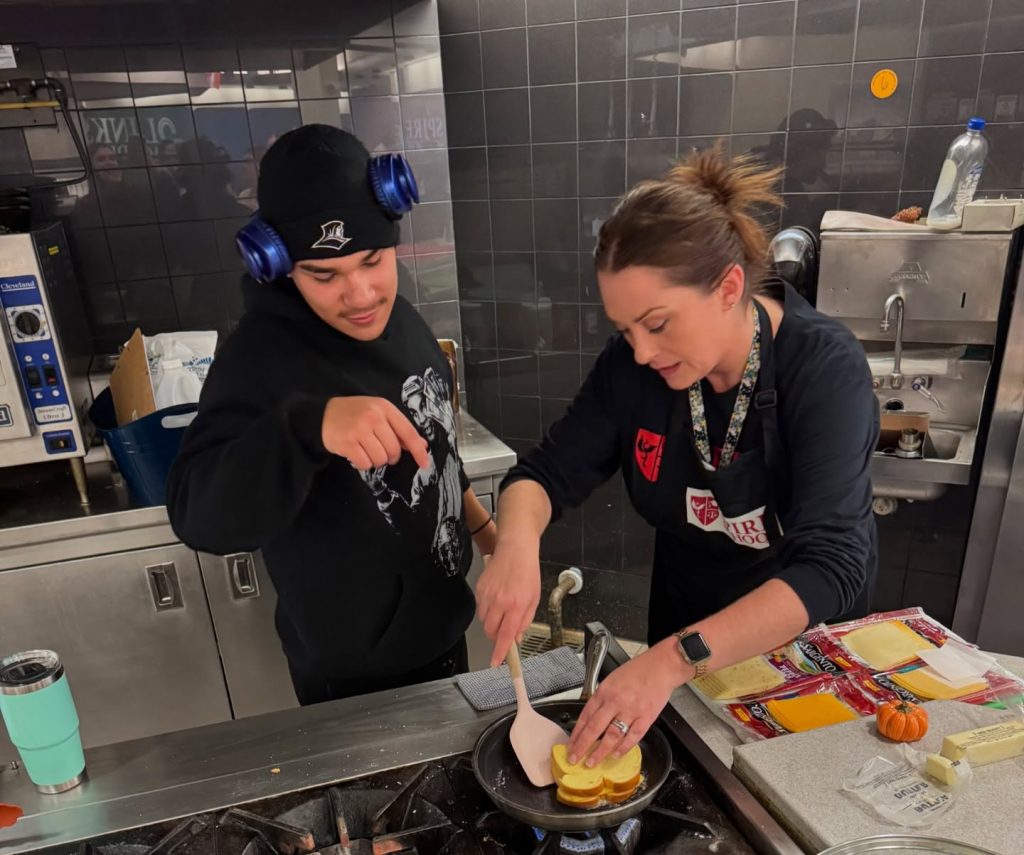 Student and teacher working together