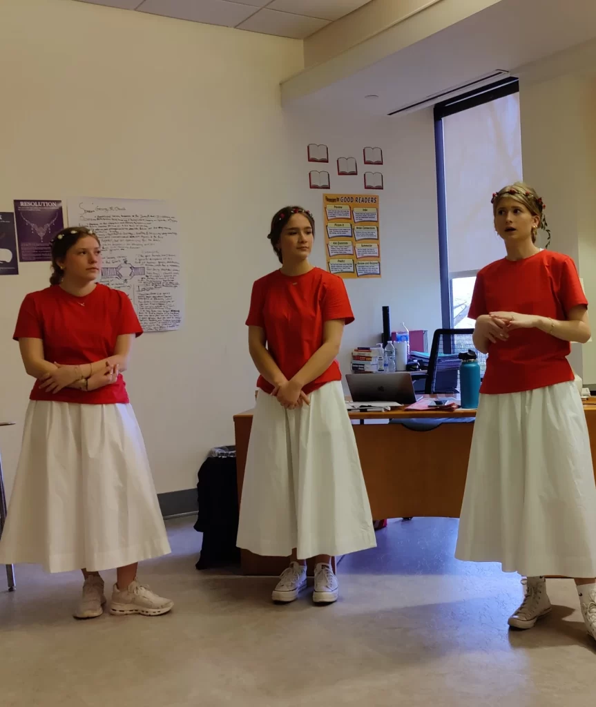 Three students presenting during World Culture Day