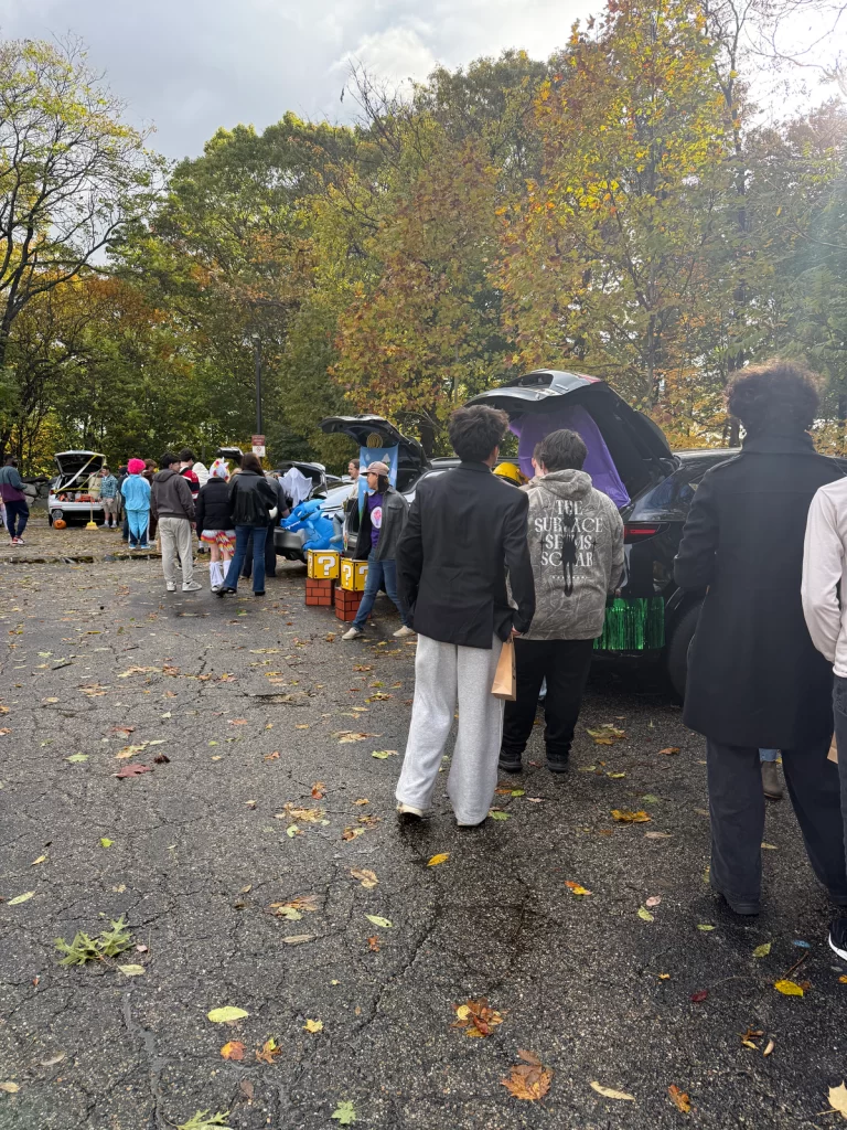 Halloween Truck or Treat participants go from vehicle to vehicle getting treats