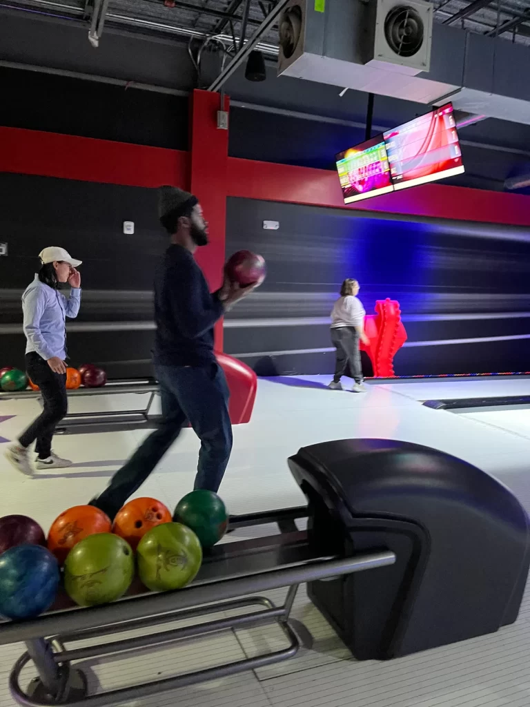 Staff member bowls during RPM Raceway staff outing