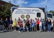 Field trip group at the CT state division of Scientific Services Labs mobile forensic services vehicle